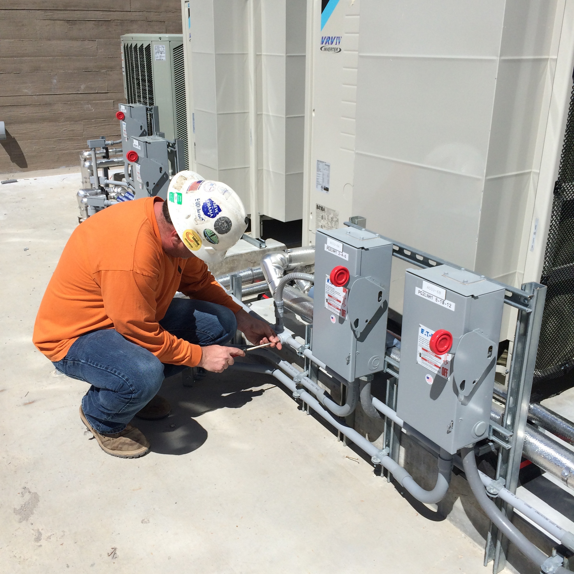 VISION electrician working on commercial equipment