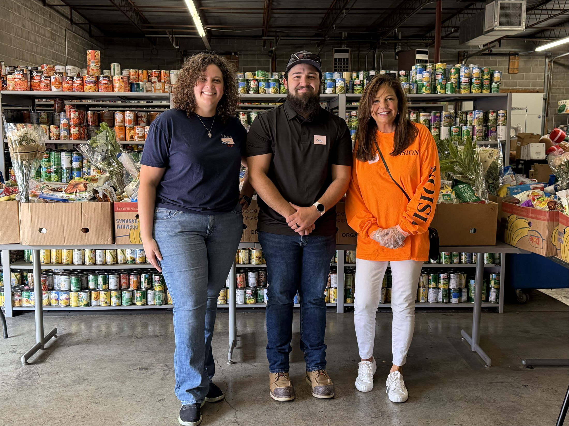 VISION volunteering with the Loaves and Fishes food pantry team in 2026