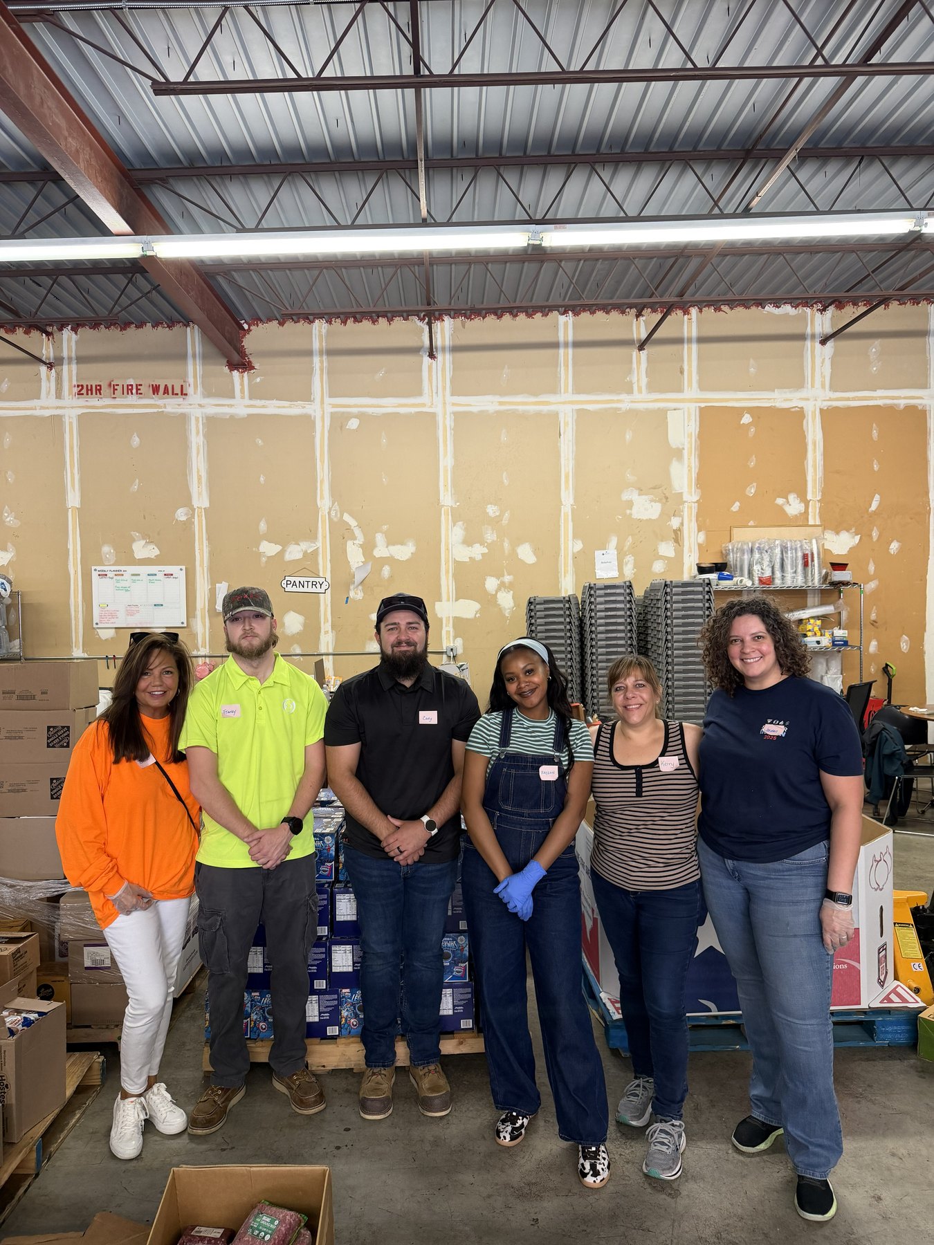 VISION volunteers inside the Loaves and Fishes food pantry