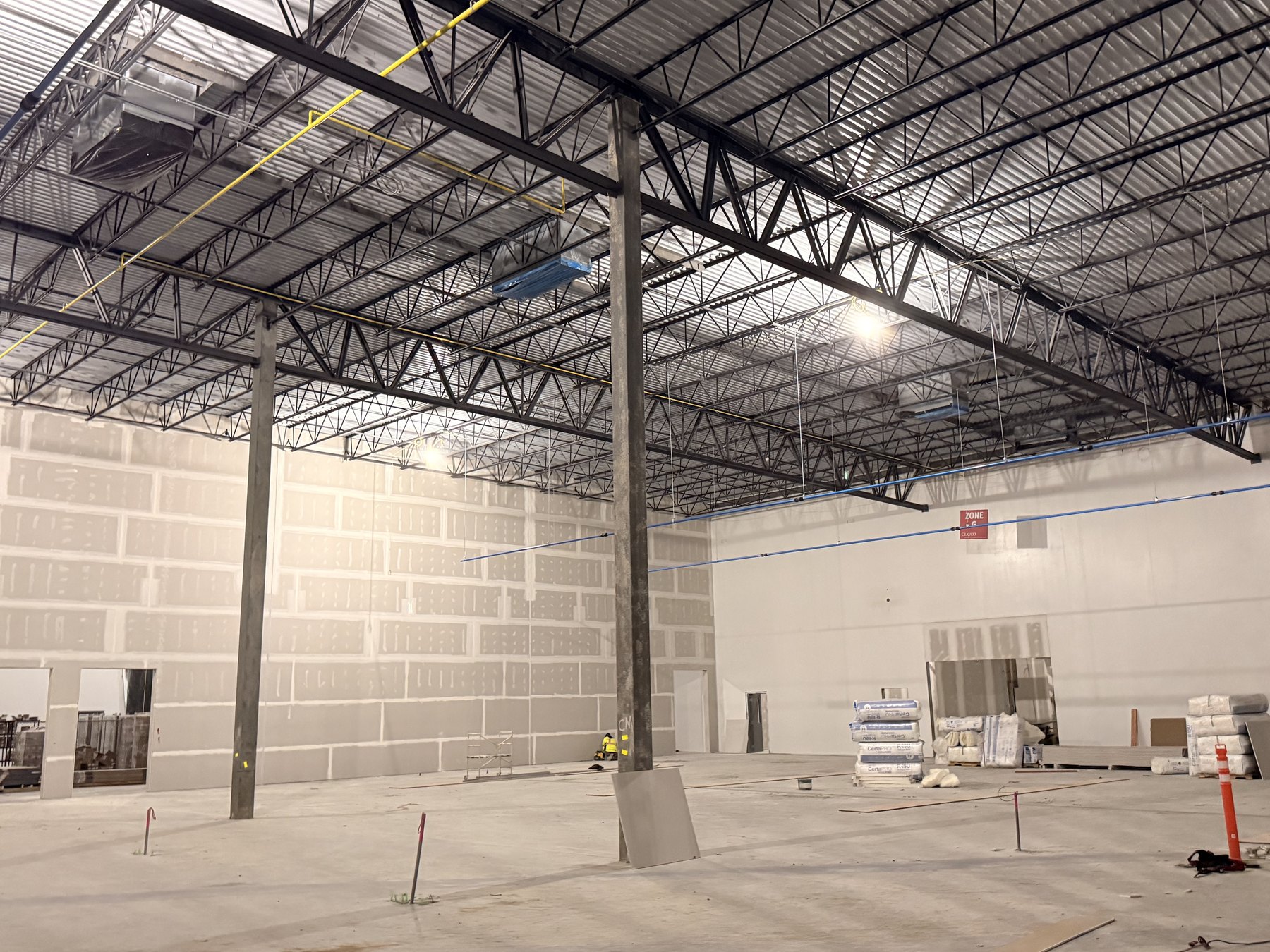 Newly installed industrial lighting illuminating an active VISION project