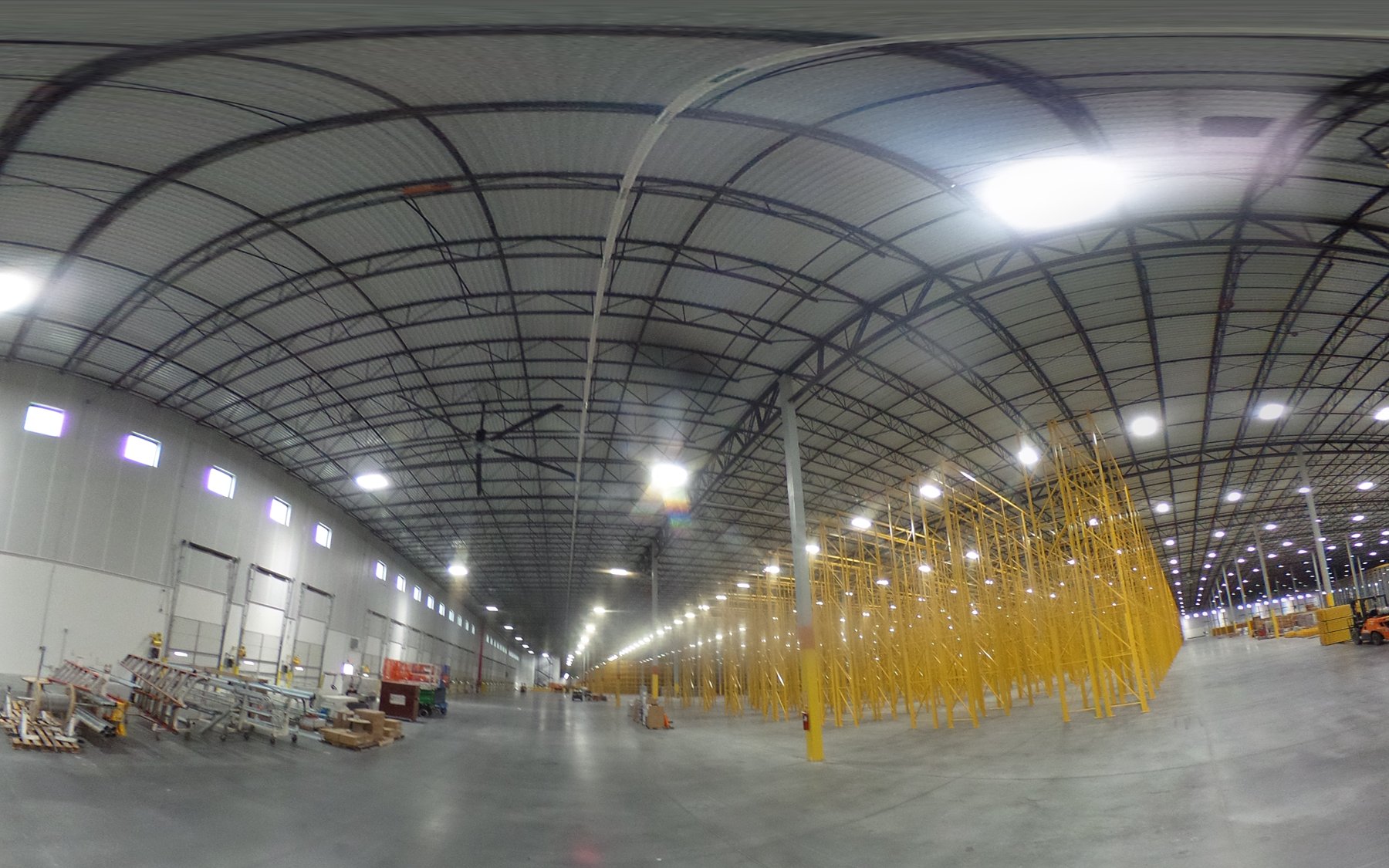 Late-stage warehouse racking and completed lighting at the ACE distribution center
