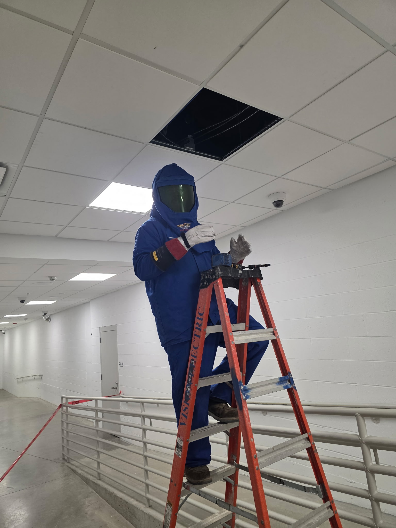 VISION technician working near installed security cameras at St. Charles Correctional Center